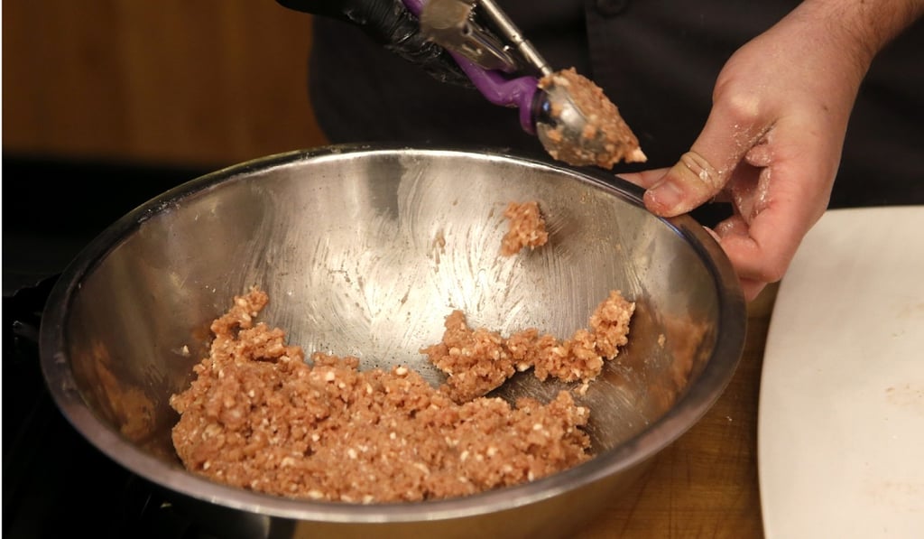 An Impossible Pork dish being prepared. Photo: AP