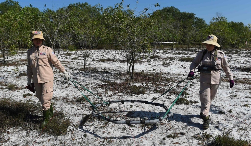 Deminers search for unexploded ordnance at a landmine site in Quang Tri province. Photo: AFP Deminers search for unexploded ordnance at a landmine site in Quang Tri province. Photo: AFP
