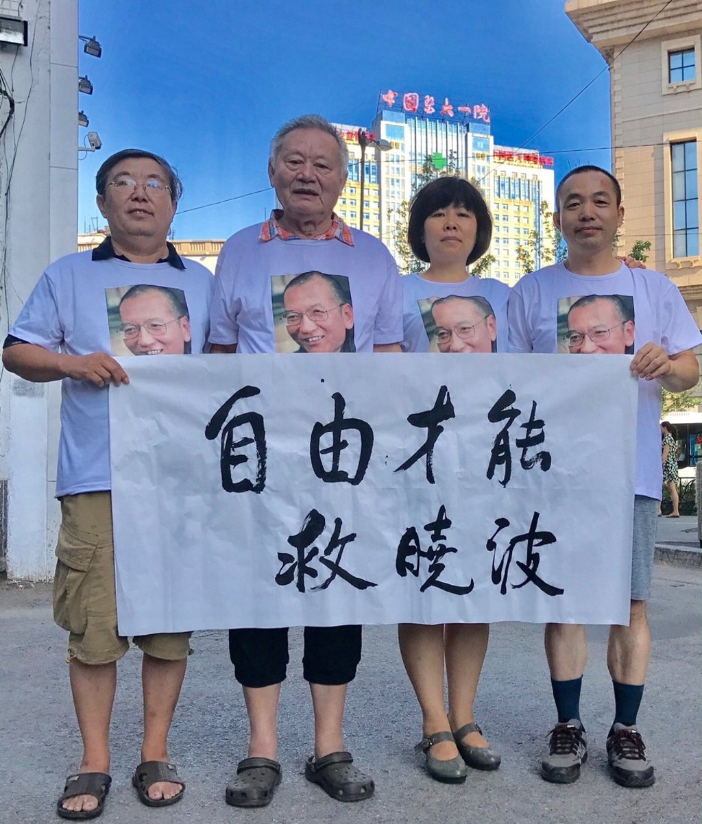 Ding Jiaxi (right) with other activists in an undated picture. Photo: Handout