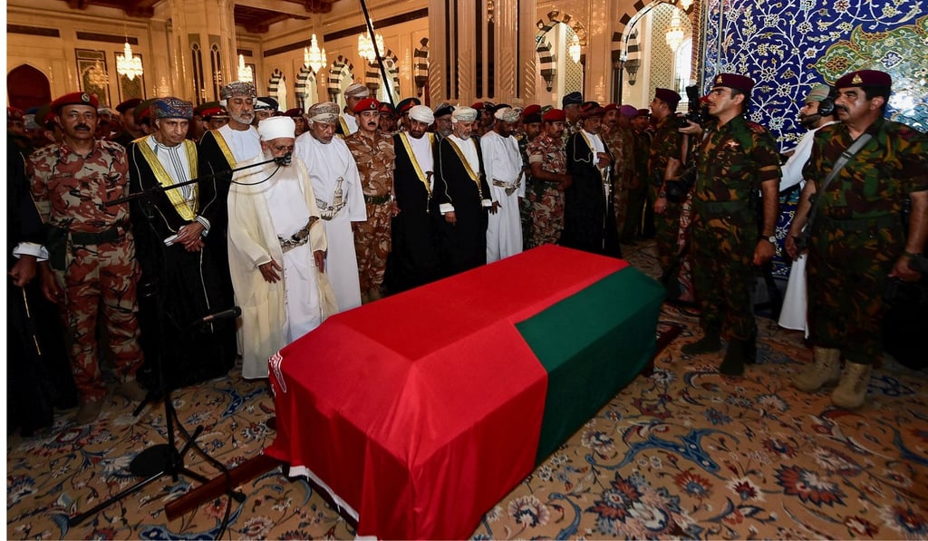 Oman's newly sworn-in Sultan Haitham bin Tariq al-Said prays with mourners next to the coffin of the late Sultan Qaboos in Muscat, Oman. Photo: Reuters
