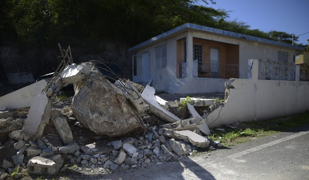 A big rock sits amid the rubble of the low wall it destroyed when it rolled down from a nearby cliff during a magnitude 5.9 earthquake in Guanica. Photo: AP Photo A big rock sits amid the rubble of the low wall it destroyed when it rolled down from a nearby cliff during a magnitude 5.9 earthquake in Guanica. Photo: AP Photo