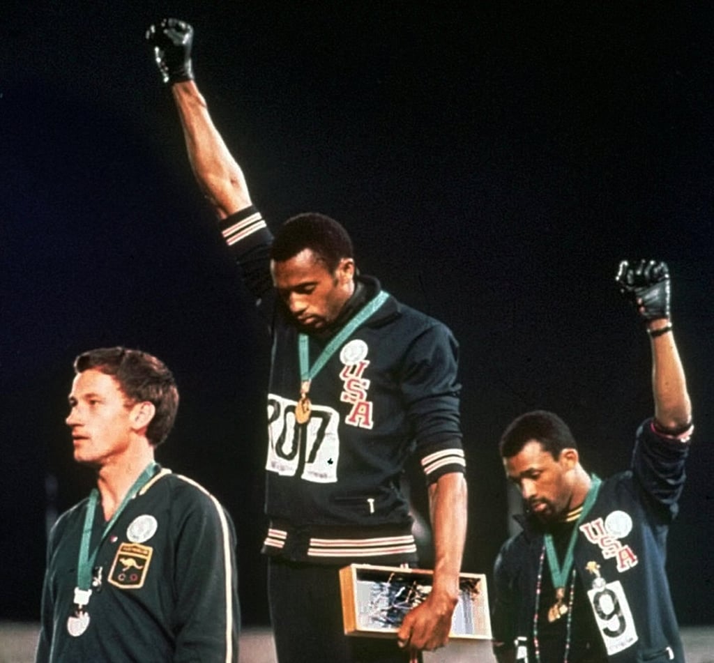 Tommie Smith (centre) and John Carlos at the 1968 Olympics in Mexico City. Photo: AP