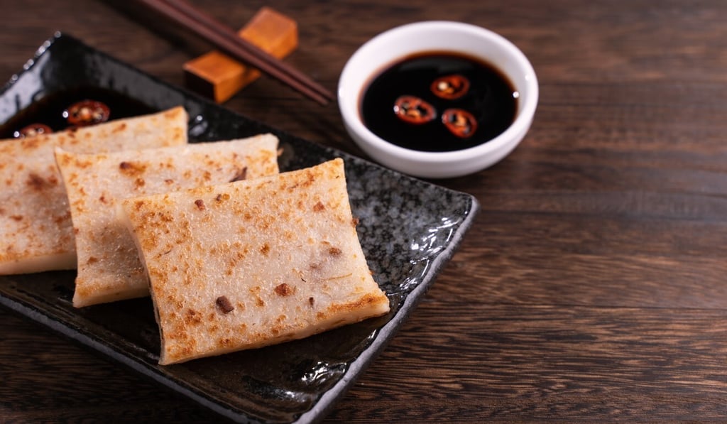 Turnip cake, a traditional Chinese radish cake with soy sauce on the side, served during Lunar New Year. Photo: Getty Images Turnip cake, a traditional Chinese radish cake with soy sauce on the side, served during Lunar New Year. Photo: Getty Images