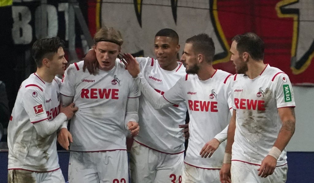 Cologne’s Sebastiaan Bornauw (second left) celebrates scoring his side’s second goal against Eintracht Frankfurt. Photo: DPA