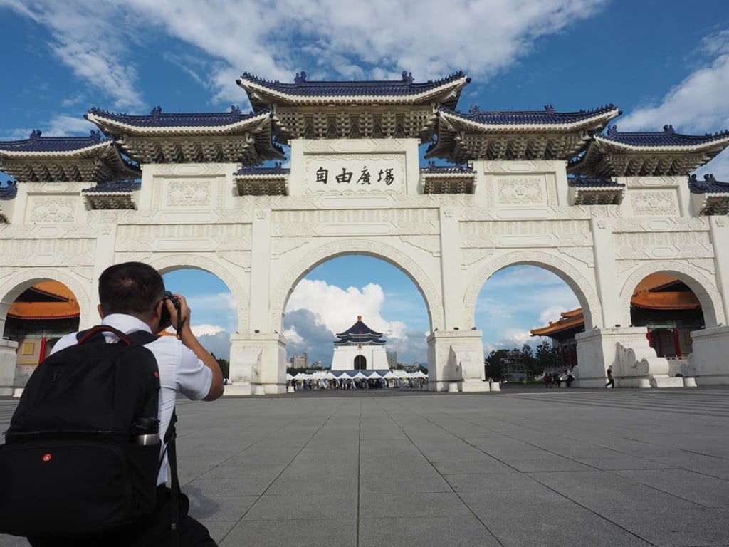 A tourist takes a photograph at Liberty Square in Taipei, Taiwan. Photo: EPA