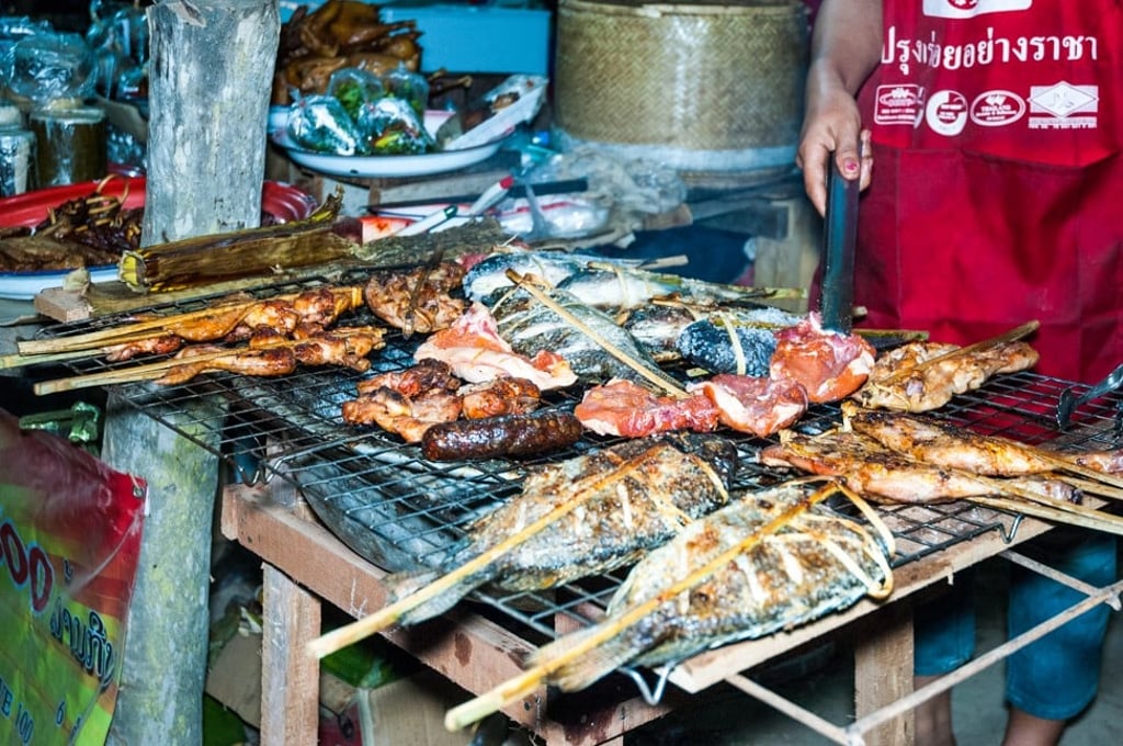 A barbecue stall at the Elephant Festival in Viengkeo Village near Hongsa, Laos A barbecue stall at the Elephant Festival in Viengkeo Village near Hongsa, Laos