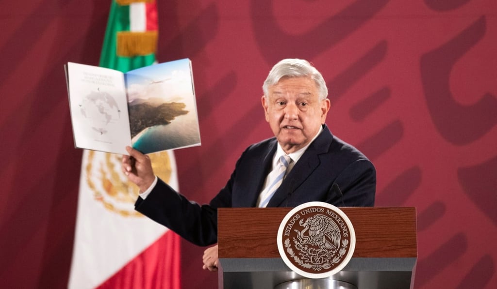 Mexico's President Andres Manuel Lopez Obrador holds up a brochure for the Boeing Dreamliner during a news conference in Mexico City on Tuesday. Photo: Reuters