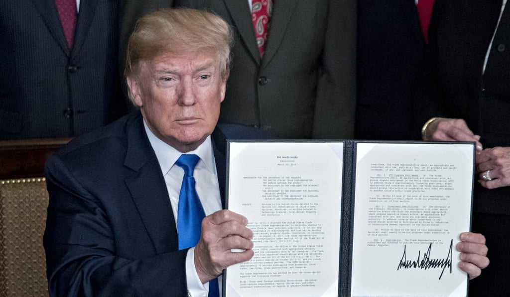 US President Donald Trump holds up a signed presidential memorandum announcing tariffs on Chinese imports worth about US$50 billion on March 22, 2018. Photo: Bloomberg