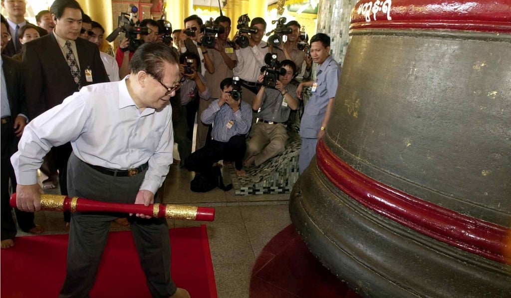 Then-president Jiang Zemin prepares to strike a giant bell during a visit to the Shwedagon pagoda in Yangon in 2001. Photo: AP