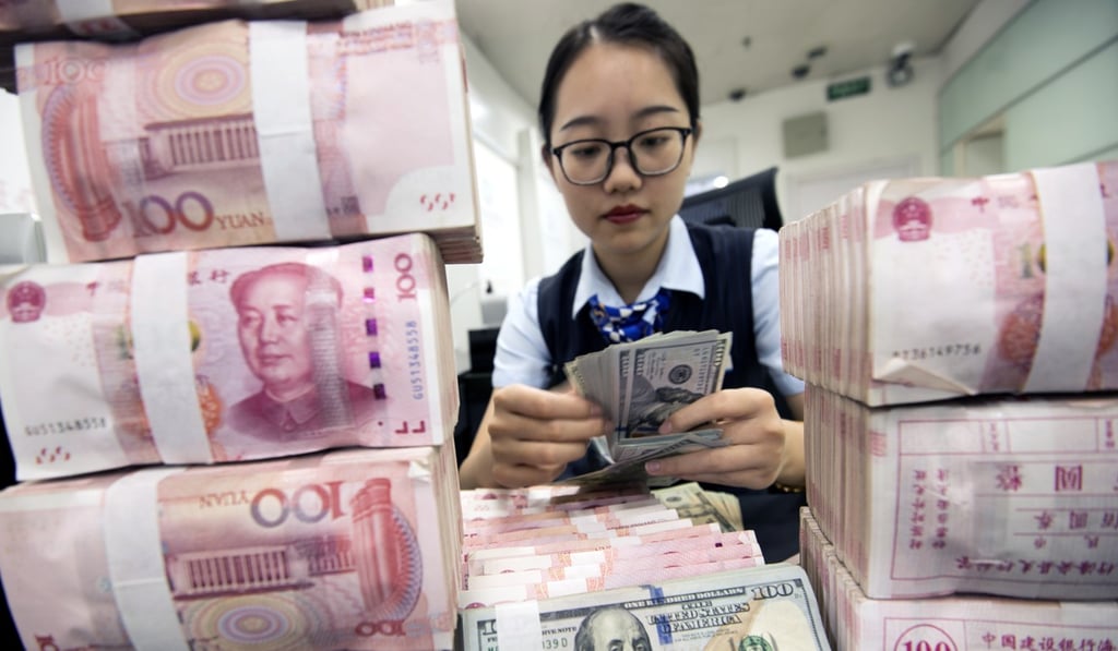 A clerk counts currency notes at a bank outlet in Hai’an city, in China’s Jiangsu province. Fintech offers the possibility of providing banking services to those whom traditional banks do not reach. Photo: EPA-EFE
