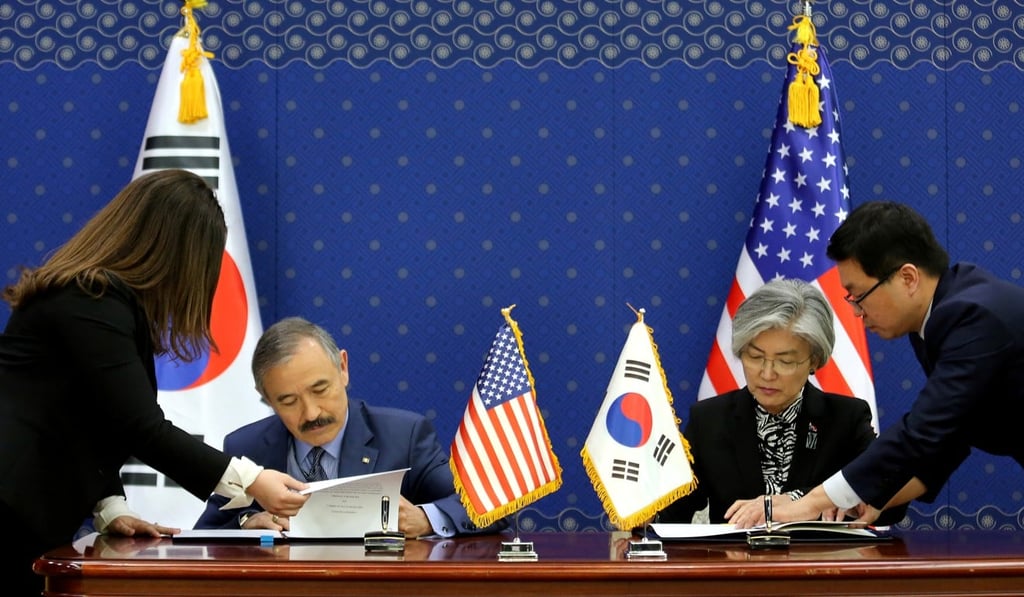 South Korean Foreign Minister Kang Kyung-wha (right) and US Ambassador to South Korea Harry Harris sign documents at the Foreign Ministry in Seoul in March 2019. Photo: Reuters South Korean Foreign Minister Kang Kyung-wha (right) and US Ambassador to South Korea Harry Harris sign documents at the Foreign Ministry in Seoul in March 2019. Photo: Reuters