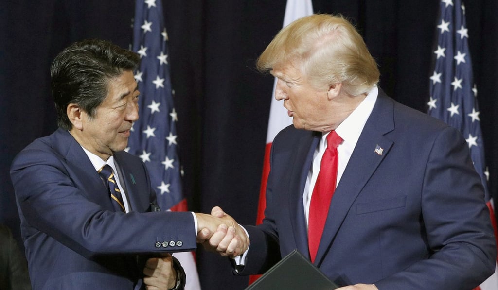 Japanese Prime Minister Shinzo Abe and US President Donald Trump shake hands in New York in September 2019 after reaching a bilateral trade agreement. Photo: Kyodo
