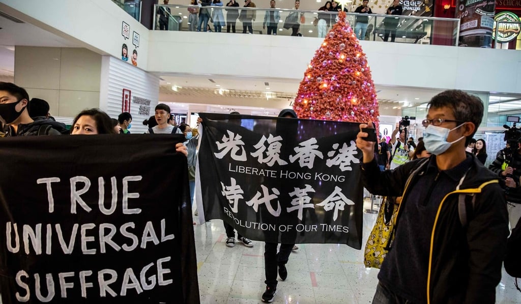 Anti-government protesters stage a demonstration at the Harbour City shopping centre in the Tsim Sha Tsui on December 21, 2019. Photo: AFP