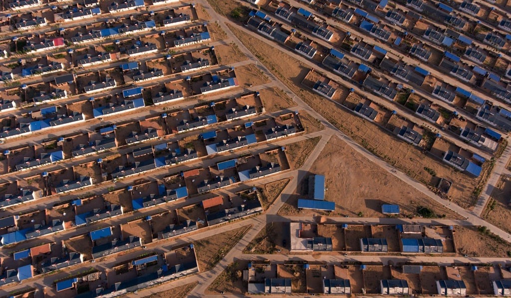 The resettlement village of Miaomiao Lake in northwest China, to which thousands of people have moved because of advancing deserts and drought. Photo: Josh Haner/The New York Times