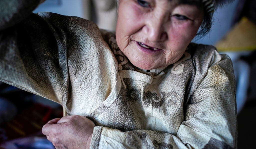 You Wenfeng learned tailoring fish skin from her mother, who kept her Hezhen traditions alive during the Japanese occupation of Manchuria. Photo: Reuters You Wenfeng learned tailoring fish skin from her mother, who kept her Hezhen traditions alive during the Japanese occupation of Manchuria. Photo: Reuters