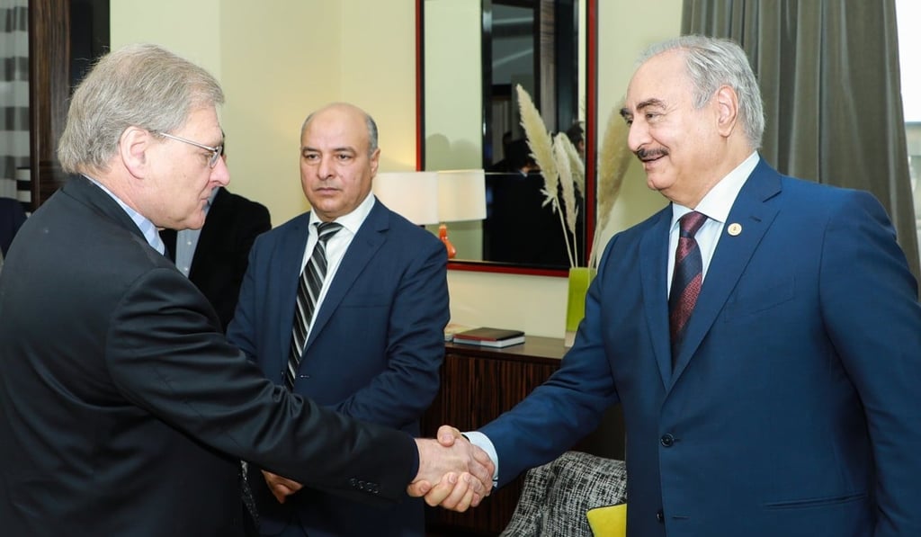 Libyan ex-general Khalifa Hiftar (right) shakes hands with US ambassador to Libya Richard Norland in Berlin. Photo: LNA War Information Division via AFP