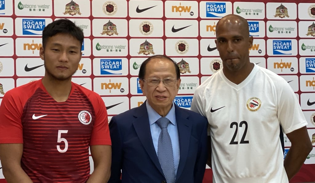 Hong Kong Football Association chairman Pui Kwan-kay and players' representatives for the 2020 Lunar New Year Cup Tsang Chi-hau (Hong Kong, left) and Fabio Alcantara (League Selection XI). Photo: Chan Kin-wa