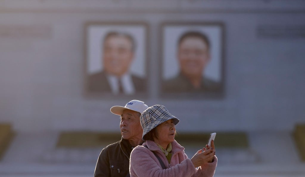 Chinese tourists in Kim Il-sung square, Pyongyang. Photo: AFP