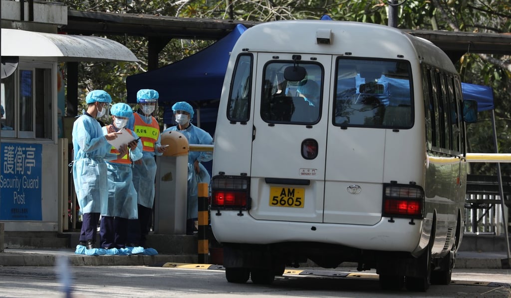 Staff at the Lady MacLehose Holiday Village in Pak Tam Chung, Sai Kung. Lady Maclehose is one of two designated quarantine facilities in Hong Kong for the Wuhan coronavirus. Photo: Nora Tam