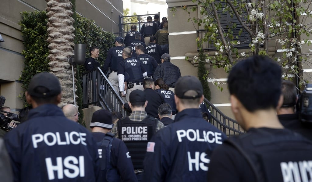 Federal agents in March 2015 swarm a complex in California where authorities say a birth tourism business charged pregnant women US$50,000 for lodging, food and transport. Photo: AP