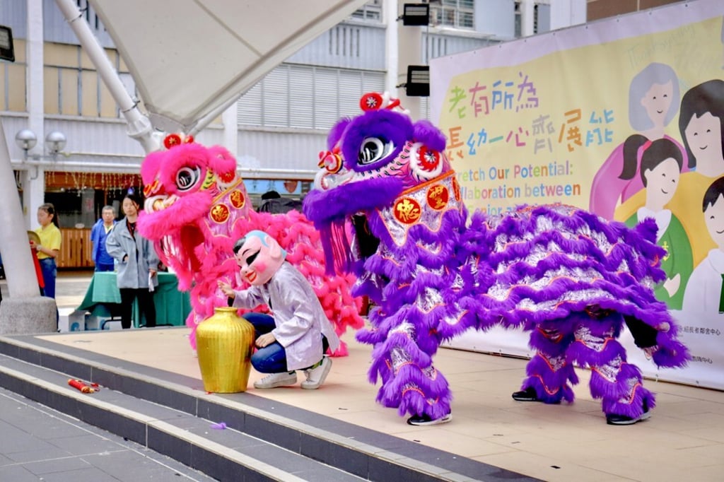 A lion dance with lion lads sees students perform alongside their mentors. Photo: Good Hope School