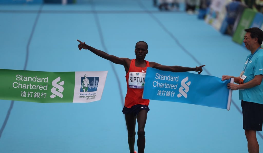 Kenya’s Barnabus Kiptum breaks the course record after crossing the finish line in Victoria Park at the 2019 Hong Kong Marathon. Photo: Nora Tam