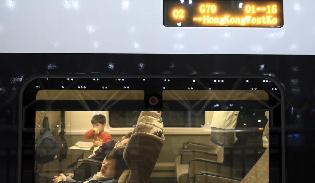 Passengers on a high-speed train from Beijing to Hong Kong, which stopped in Wuhan but did not let any passengers board. Photo: May Tse