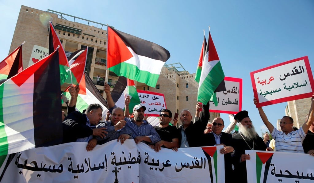 Palestinians protest against the opening of the new US embassy in Jerusalem May, 2018. One banner reads in Arabic ‘Jerusalem Arab, Palestinian, Islamic and Christian’. Photo: Reuters