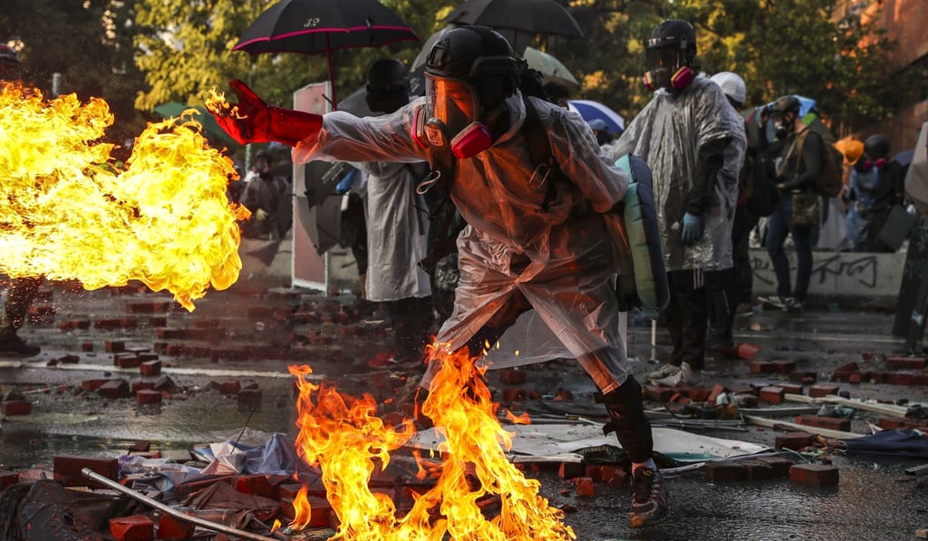 Clashes break out between riot police and students near the Hong Kong Polytechnic University in Hung Hom in November 2019. Photo: Sam Tsang
