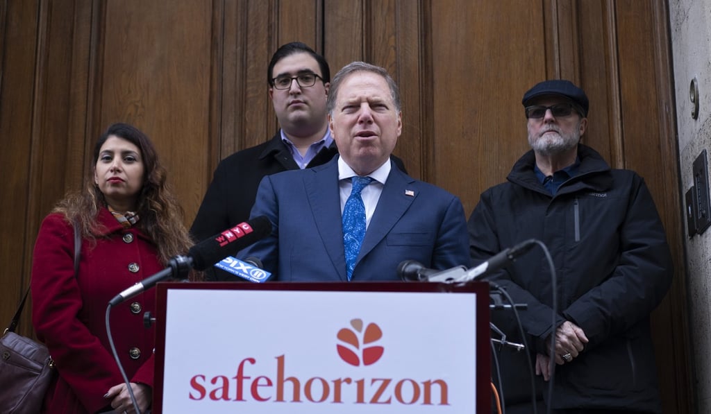 US Attorney Geoffrey Berman, standing with victims of childhood sexual abuse, speaks at an event held by Safe Horizon, a non-profit victim services agency, in front of Jeffrey Epstein's Manhattan residence on Monday. Photo: AP