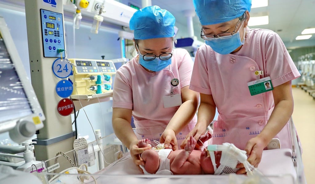 Nurses take care of a newborn baby at a hospital in Qinhuangdao in Hebei province on January 24. The statistics bureau said China had 15.23 million births in 2018, but the Health Statistics Yearbook recorded only 13.62 million. Photo: Xinhua Nurses take care of a newborn baby at a hospital in Qinhuangdao in Hebei province on January 24. The statistics bureau said China had 15.23 million births in 2018, but the Health Statistics Yearbook recorded only 13.62 million. Photo: Xinhua