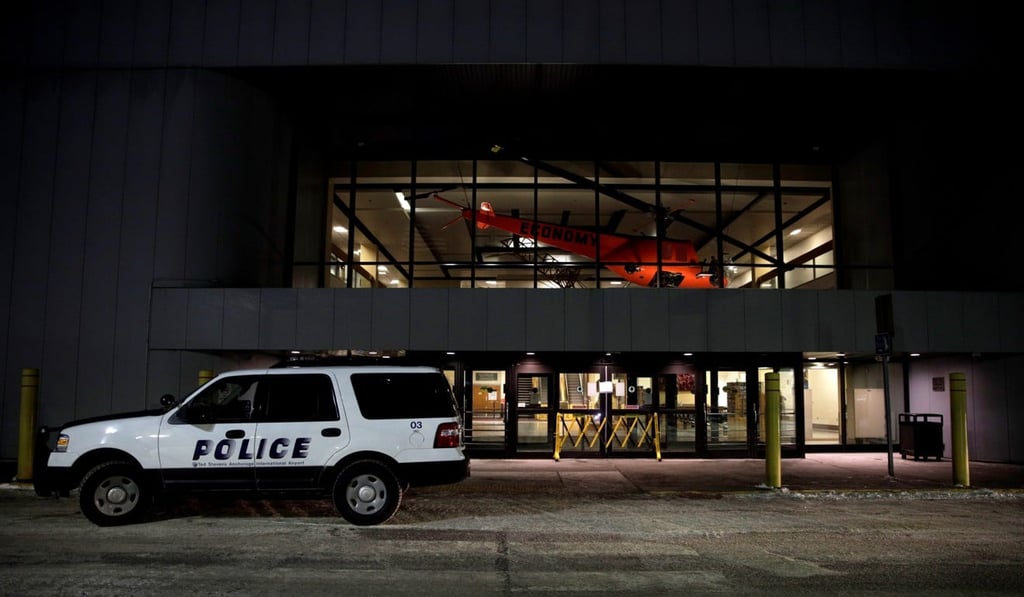 A police car is seen at a closed terminal in Anchorage, Alaska, as a plane carrying evacuated Americans stopped to refuel and for health screenings. Photo: Reuters A police car is seen at a closed terminal in Anchorage, Alaska, as a plane carrying evacuated Americans stopped to refuel and for health screenings. Photo: Reuters