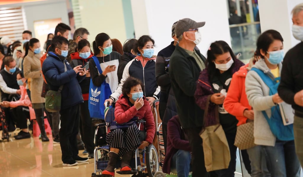 Long queues have formed all over Hong Kong after the health care retail giant Watsons said it has a small supply of masks. Photo: May Tse