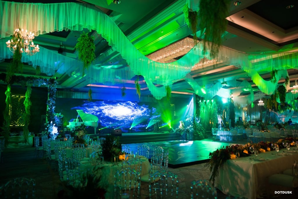 Who needs a beach, when you’ve got LED screens at your wedding? Photo: DotDusk