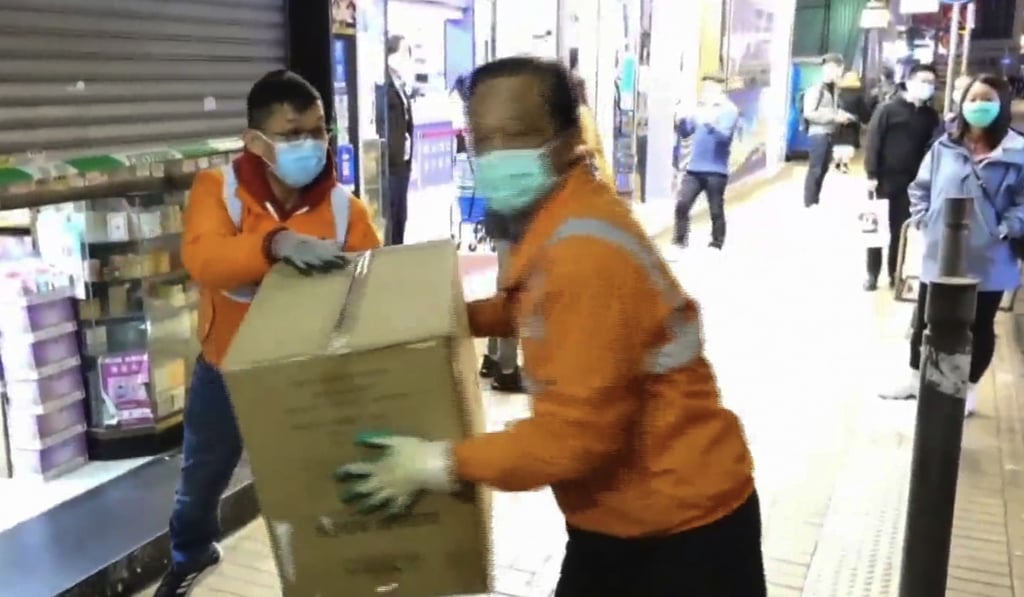 Customs seizing cartons thought to contain bogus masks. Photo: Cable News