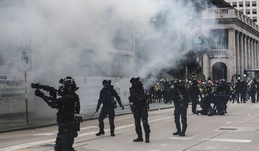 Tear gas and riot police have been a regular sight in Central and other parts of Hong Kong, which has had a devastating impact on city tourism. Photo: Sam Tsang