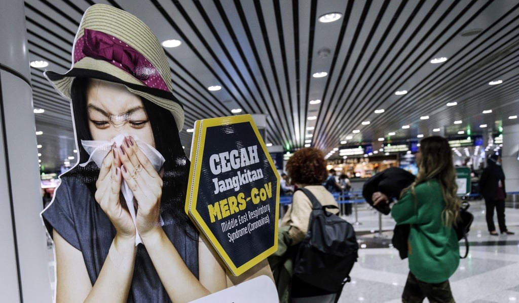 A poster about the coronavirus at the Kuala Lumpur International Airport. Photo: EPA