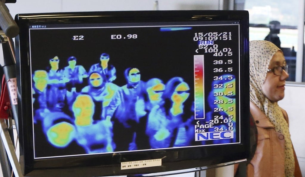 A thermal camera monitors passengers arriving at the Incheon International Airport in Seoul for the Middle East Respiratory Syndrome. Photo: AP