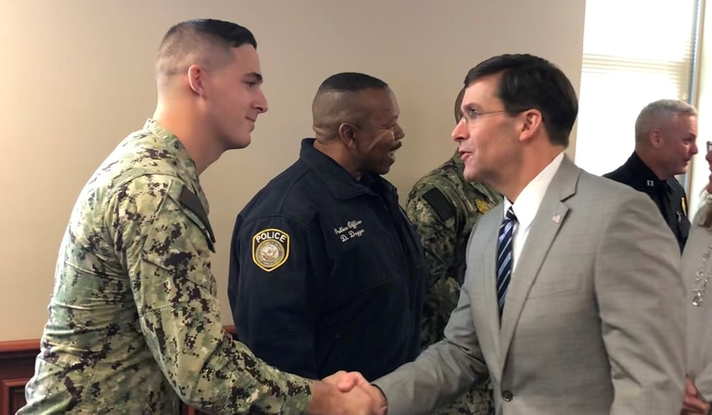 US Defense Secretary Mark Esper meets Navy sailor David Link, one of the first responders at the scene of a December 6, 2019 shooting at Naval Air Station Pensacola. Photo: Reuters