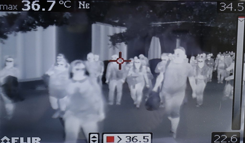 A thermal scanner checks arriving passengers for the coronavirus at Manila's international airport. Photo: AP