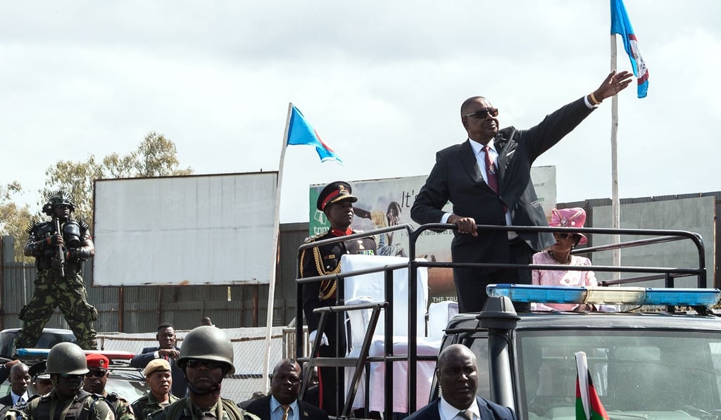 Malawi’s president-elect Peter Mutharika waves at supporters as he leaves Kamuzu Stadium in Blantyre after his inauguration in May. Photo: AFP