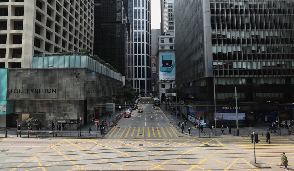 Few employees are seen around major offices and retail rows in Central, Hong Kong as lunch hour approaches amid the coronavirus outbreak. Photo: Winson Wong