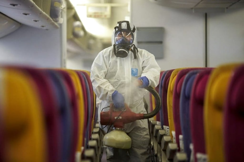 A Thai Airways crew member disinfects an aircraft cabin at Bangkok’s Suvarnabhumi International Airport on January 28. Photo: Reuters A Thai Airways crew member disinfects an aircraft cabin at Bangkok’s Suvarnabhumi International Airport on January 28. Photo: Reuters