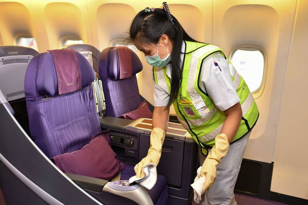 A Thai Airways staff member disinfects an aircraft at the airline’s hangar in Bangkok on January 29. Photo: AFP A Thai Airways staff member disinfects an aircraft at the airline’s hangar in Bangkok on January 29. Photo: AFP