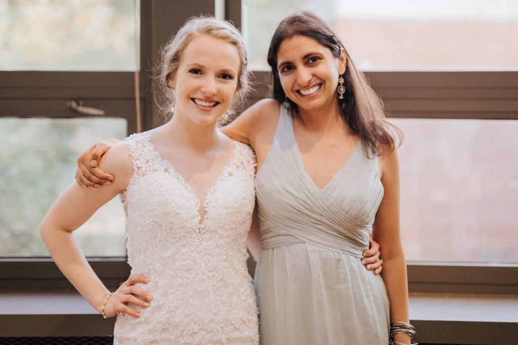 Sarah Allmon (left) and Zeenat Singh meet for the first time at Allmon’s wedding in Michigan.