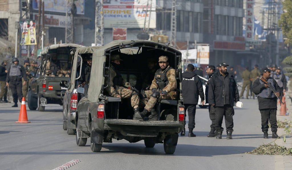 Soldiers and police commandos patrol around a cricket stadium in Rawalpindi, Pakistan, where the Bangladeshi cricket team were practising. Photo: AP Soldiers and police commandos patrol around a cricket stadium in Rawalpindi, Pakistan, where the Bangladeshi cricket team were practising. Photo: AP