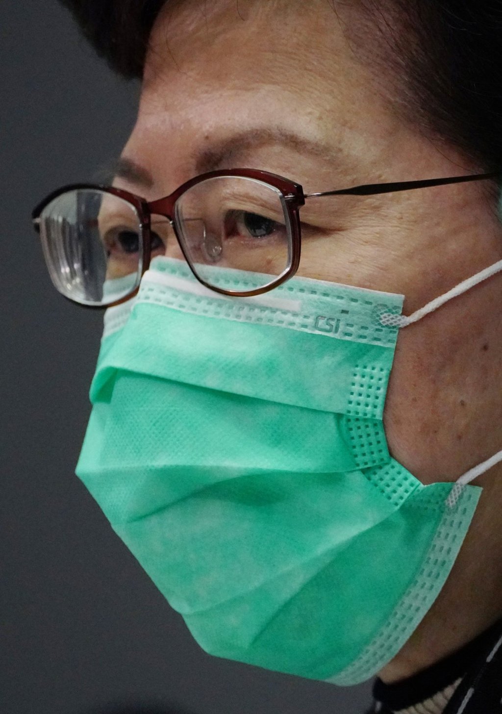 Chief Executive Carrie Lam wears a mask marked CSI – for Correctional Services Industries – at a press conference on January 28. Photo: Robert Ng