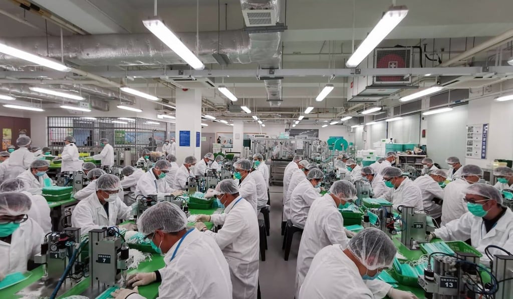 Volunteer officers from the Correctional Service Department produce masks at Lo Wu Correctional Institution. Photo: Handout