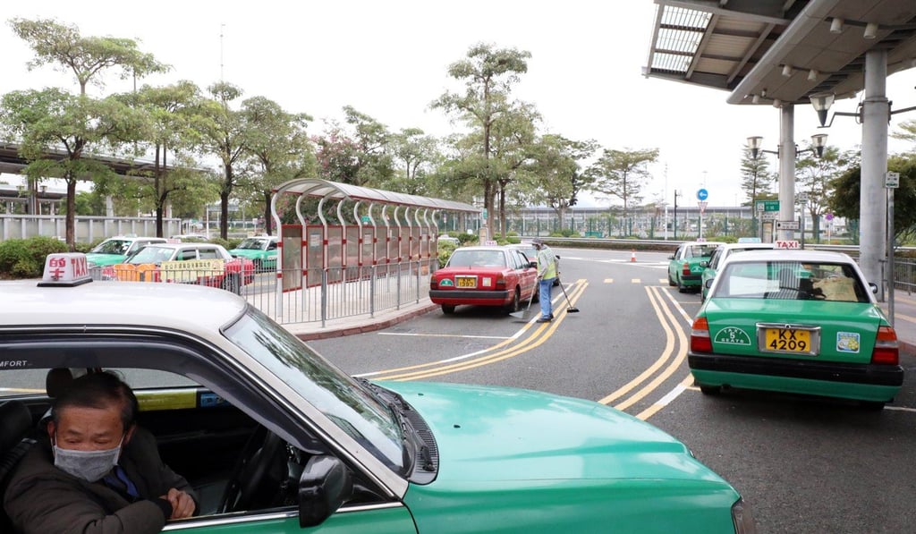 Taxi drivers wait at Shenzhen Bay Port as few people cross into Hong Kong on Saturday morning. Photo: Felix Wong