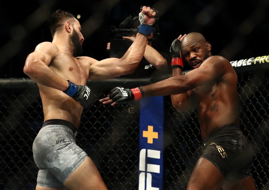 Dominick Reyes throws a punch at Jon Jones. Dominick Reyes throws a punch at Jon Jones.